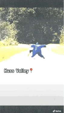 Huss Valley GIF still showing a blue-clad runner on a path with the Huss Valley location caption.